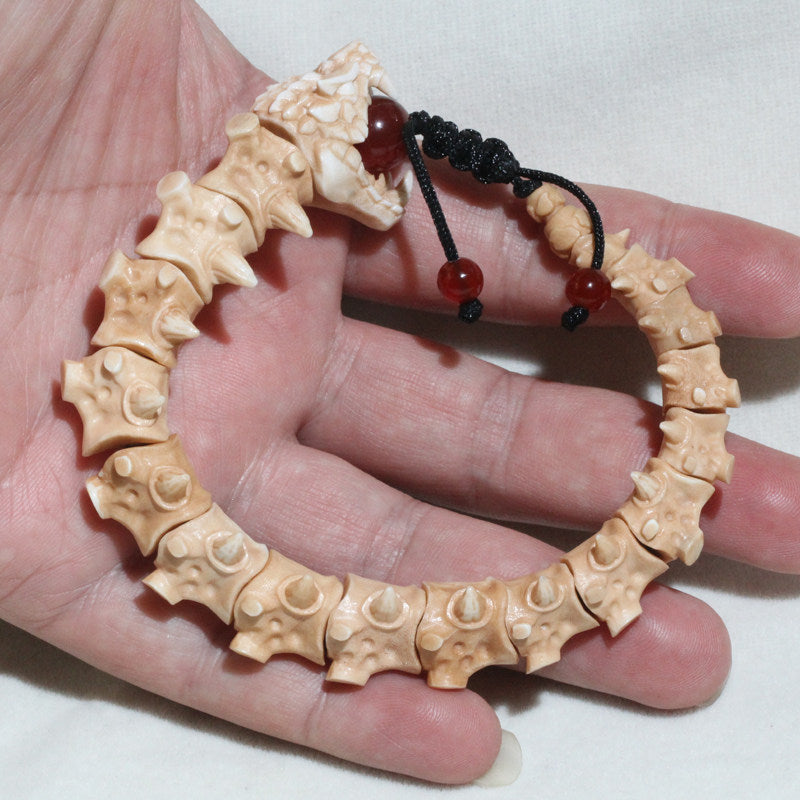 Antiqued Carved Antler Dragon Holding a Bead Bracelet