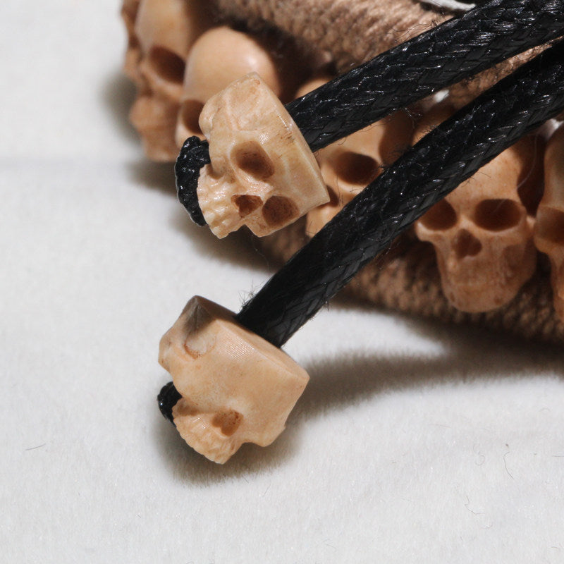 Antiqued Deer Antler Carved Skull Woven Bracelet