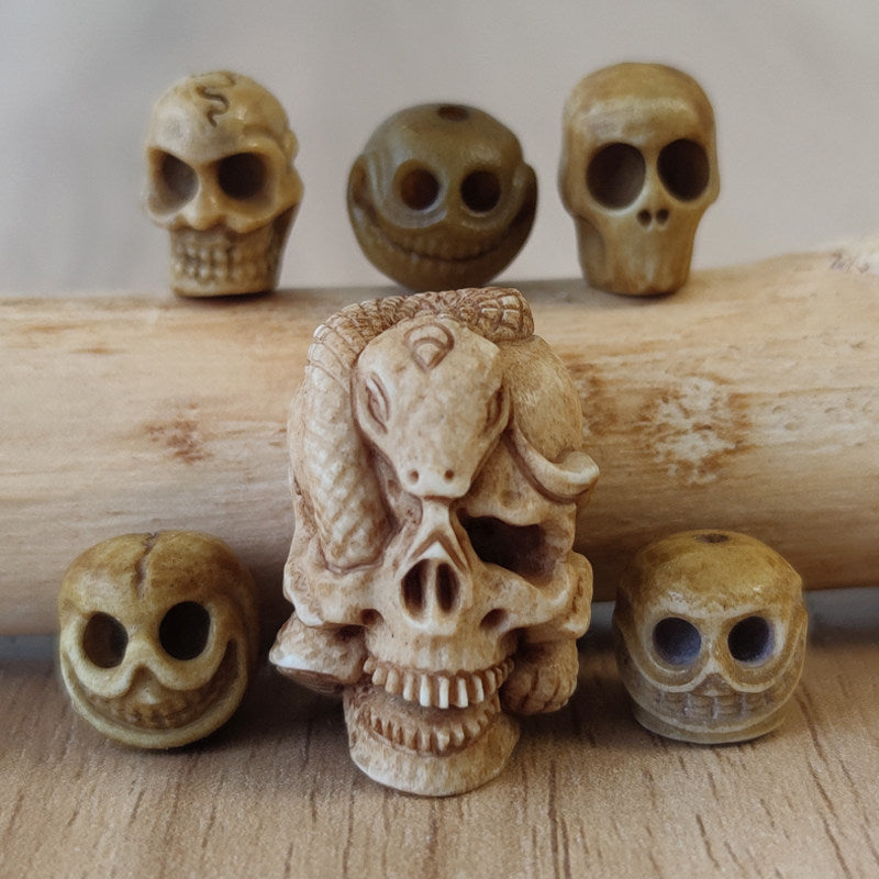 Antler-Carved Skull Bead with Coiled Serpent
