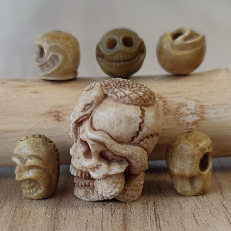 Antler-Carved Skull Bead with Coiled Serpent