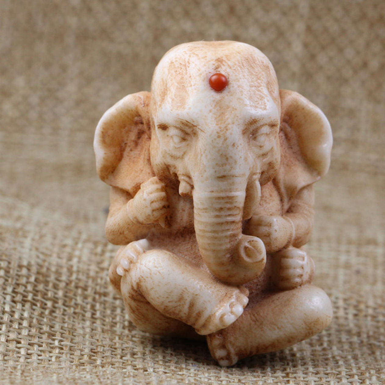Carved Antler Four-Armed Baby Elephant Pendant