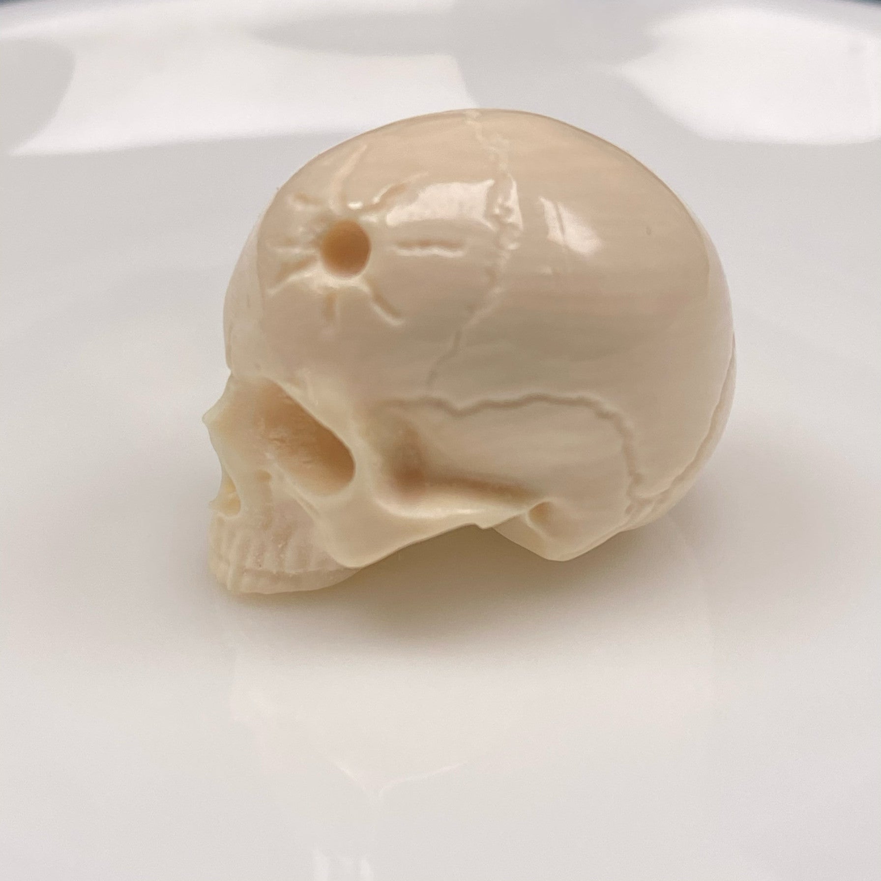 Carved Mammoth Ivory Half-Jaw Skull Bead