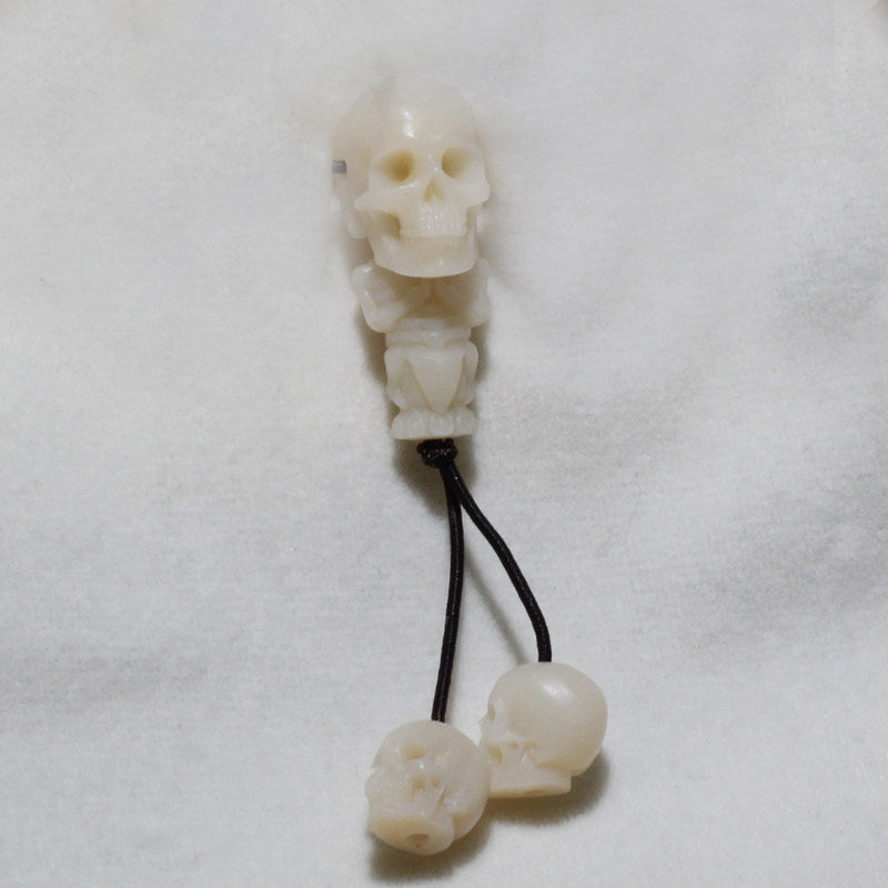 Hand-carved Triple Skull Ox Bone Charm