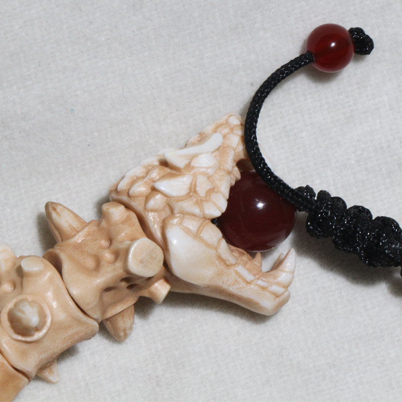 Antiqued Carved Antler Dragon Holding a Bead Bracelet