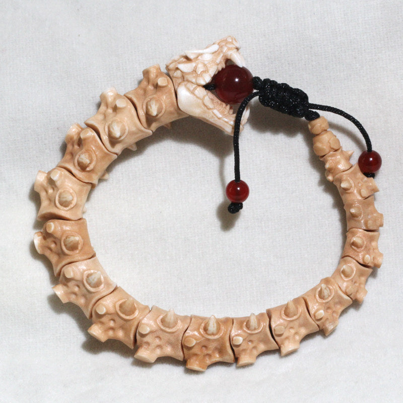 Antiqued Carved Antler Dragon Holding a Bead Bracelet