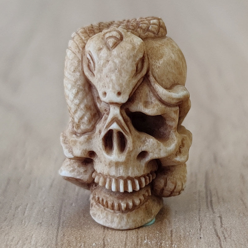 Antler-Carved Skull Bead with Coiled Serpent