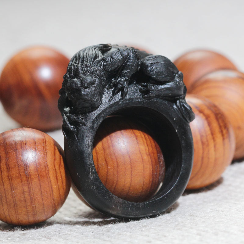 Black Buffalo Horn Ring Carved with a Coiled Beast