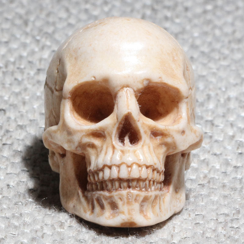 Hand-Carved Antler Human Skull Bead